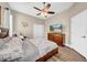 Comfortable bedroom with ceiling fan, hardwood floors, closet and dresser at 32624 Summerglade Dr, Wesley Chapel, FL 33545