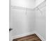 Empty walk-in closet with wood floors and wire rack shelving at 32624 Summerglade Dr, Wesley Chapel, FL 33545