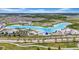Beautiful aerial view of the community pool and amenity center, surrounded by lush landscaping and residences at 32624 Summerglade Dr, Wesley Chapel, FL 33545