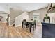 Charming dining area featuring a wooden table with seating for four, complemented by stylish decor and natural light at 32624 Summerglade Dr, Wesley Chapel, FL 33545