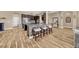 Kitchen island with stone accent and seating for four, open to the living room at 32624 Summerglade Dr, Wesley Chapel, FL 33545