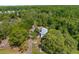 Aerial view of property nestled among lush trees and a long driveway at 3373 Olson Rd, Spring Hill, FL 34607