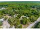 Aerial view displaying property's natural beauty, featuring abundant trees and landscaping, located near neighborhood at 3373 Olson Rd, Spring Hill, FL 34607