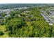 Scenic aerial perspective of property, highlighting the abundance of mature trees surrounding the neighborhood at 3373 Olson Rd, Spring Hill, FL 34607