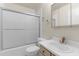 Bathroom with shower and tub combination, mirror, sink and toilet at 3373 Olson Rd, Spring Hill, FL 34607