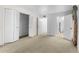 Bedroom with large closet, standard doors to bathroom and hallway, and carpet flooring at 3373 Olson Rd, Spring Hill, FL 34607