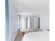 Spacious bedroom featuring large closet space and blue curtains at 3373 Olson Rd, Spring Hill, FL 34607