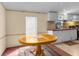 Cozy dining area adjacent to kitchen, bathed in natural light, creating a pleasant dining experience at 3373 Olson Rd, Spring Hill, FL 34607