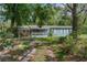 Charming single-story home with a screened porch and well-maintained landscaping at 3373 Olson Rd, Spring Hill, FL 34607
