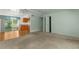 Open-concept living space with a seamless transition to the kitchen and a view of the screened patio at 3373 Olson Rd, Spring Hill, FL 34607