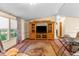 Comfortable living room featuring a large entertainment center and cozy seating area at 3373 Olson Rd, Spring Hill, FL 34607