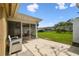 Backyard featuring patio with a screened-in lanai at 3628 Dellefield St, New Port Richey, FL 34655