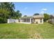 Well-maintained backyard features a screened lanai, a shed, and ample green space at 3628 Dellefield St, New Port Richey, FL 34655