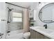 Updated bathroom with a tiled shower, new fixtures, and ample storage space at 3628 Dellefield St, New Port Richey, FL 34655