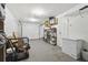 Spacious garage includes a freezer, work space, and backyard access door at 3628 Dellefield St, New Port Richey, FL 34655