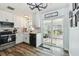 Beautiful kitchen with white cabinets, stainless steel appliances, and sliding glass doors to sunroom at 3628 Dellefield St, New Port Richey, FL 34655