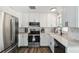 Bright kitchen featuring stainless steel appliances, white cabinets and subway tile backsplash at 3628 Dellefield St, New Port Richey, FL 34655