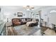Bright living room features a large leather sectional, stylish rug, and lots of natural light at 3628 Dellefield St, New Port Richey, FL 34655