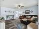 Spacious living room with hardwood floors and stylish decor creates a cozy and inviting atmosphere at 3628 Dellefield St, New Port Richey, FL 34655