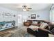 Open-concept living room boasts modern decor, hardwood floors, and a comfortable layout at 3628 Dellefield St, New Port Richey, FL 34655