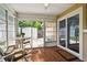 Inviting sunroom with outdoor seating, access to the backyard, and lots of natural light at 3628 Dellefield St, New Port Richey, FL 34655