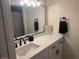 Modern bathroom featuring a sleek vanity, updated fixtures, and a well-lit mirror at 3640 41St S Ln # F, St Petersburg, FL 33711