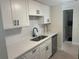 Updated kitchen featuring modern fixtures, white cabinets, subway tile backsplash and stainless steel dishwasher at 3640 41St S Ln # F, St Petersburg, FL 33711