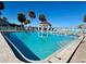Beautiful outdoor pool area surrounded by lounge chairs and lush landscaping at 3640 41St S Ln # F, St Petersburg, FL 33711
