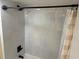Bright shower featuring tiled walls, rainfall shower head, and a shower curtain at 3640 41St S Ln # F, St Petersburg, FL 33711