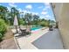 Outdoor patio with seating, barbecue grill, pool, shed and landscaping at 3641 Coppertree Cir, Brandon, FL 33511