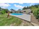 Outdoor patio with seating beside pool, backyard, and shed at 3641 Coppertree Cir, Brandon, FL 33511