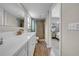 Modern bathroom featuring a walk-in shower, white vanity and a neutral color palette at 3641 Coppertree Cir, Brandon, FL 33511