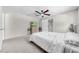 Bedroom with carpet, ceiling fan, light colored walls and en suite bathroom at 3641 Coppertree Cir, Brandon, FL 33511