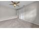 Bright bedroom with neutral walls, carpet, ceiling fan, and closet at 3641 Coppertree Cir, Brandon, FL 33511
