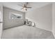 Bedroom with a ceiling fan, neutral carpet and a window for natural light at 3641 Coppertree Cir, Brandon, FL 33511