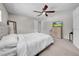 Cozy bedroom with a ceiling fan, dresser, and a neutral color scheme at 3641 Coppertree Cir, Brandon, FL 33511