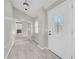 Welcoming foyer with neutral paint, tile floors, and a decorative front door leading into the home at 3641 Coppertree Cir, Brandon, FL 33511