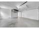 Bright garage with a concrete floor, storage and garage door opener at 3641 Coppertree Cir, Brandon, FL 33511
