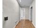 Hallway with wood flooring, neutral paint, and doors leading to other rooms at 3641 Coppertree Cir, Brandon, FL 33511