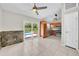 Open kitchen and dining area with wood cabinets, stainless steel appliances, and sliding glass doors to the pool at 3641 Coppertree Cir, Brandon, FL 33511
