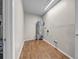 Utility room with wood-look flooring, water heater, and neutral paint at 3641 Coppertree Cir, Brandon, FL 33511