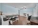 Spacious dining area featuring a large table, hardwood floors, and a built-in bench seat at 3849 Hollow Oak Pl, Land O Lakes, FL 34639