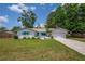 Charming single-story home featuring a well-manicured lawn and inviting curb appeal at 3849 Hollow Oak Pl, Land O Lakes, FL 34639