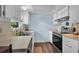 Cozy kitchen featuring stainless steel appliances, tile flooring, and ample cabinet space at 3849 Hollow Oak Pl, Land O Lakes, FL 34639