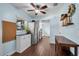 Well-lit kitchen area with modern stainless-steel appliances and hardwood floors at 3849 Hollow Oak Pl, Land O Lakes, FL 34639