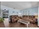 Inviting living room featuring hardwood floors, comfortable seating, and stylish decor at 3849 Hollow Oak Pl, Land O Lakes, FL 34639