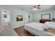 Spacious main bedroom with a TV, hardwood floors, and plenty of storage at 3849 Hollow Oak Pl, Land O Lakes, FL 34639
