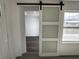 Hallway features frosted sliding door, gray tile stairs, and an open view of the living space at 3980 55Th N Ave, St Petersburg, FL 33714