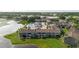 Attractive aerial view of a lakeside residential community with lush green lawns and a community swimming pool at 4030 Cortez Dr # C, Tampa, FL 33614