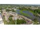 Wonderful aerial view of residential community with lake and sports courts for recreation and enjoyment at 4030 Cortez Dr # C, Tampa, FL 33614
